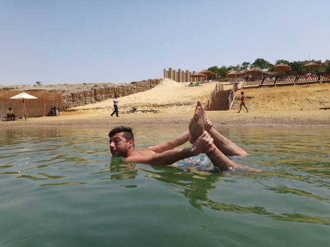 dead sea, camel pose, yoga, mud, holiday inn, beach, vacation, tan,